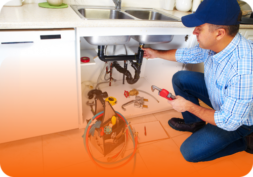 Plumber at work fixing a leak