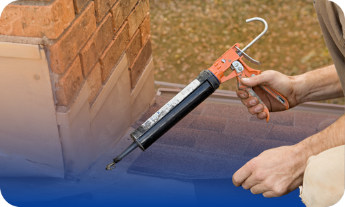 Caulk being applied to the exterior of a chimney