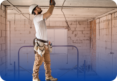 Electrician wiring the ceiling
