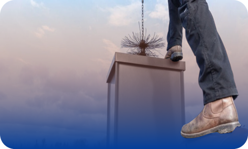 Contractor cleaning a fireplace