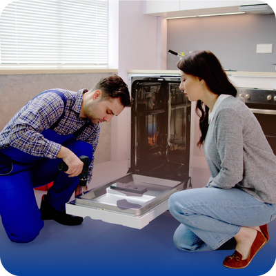 A man and woman work collaboratively to fix a malfunctioning dishwasher in a home kitchen.