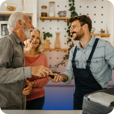 A man and woman are positioned in front of a cash register, appearing to discuss their purchase.