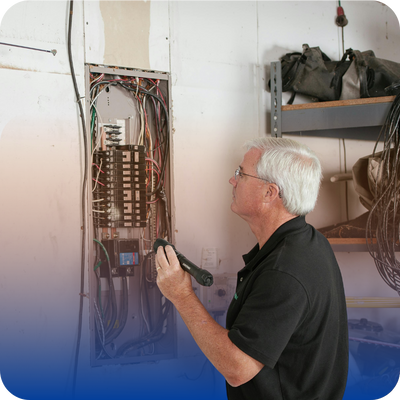 A man grips a tool in his hand, ready to work, showcasing his concentration and skill.