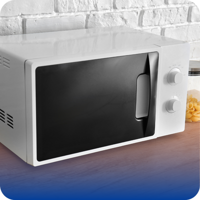A microwave oven on a table, illustrating common small appliance issues for homeowners.