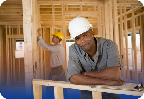 A man in a hard hat is featured on a blue background, symbolizing our commitment to quality monitoring for contractors.