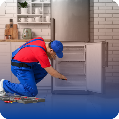 A man wearing blue overalls fixes an appliance, representing the expertise available for homeowners in need of repairs.