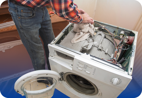 A man is positioned by a washing machine, illustrating the urgency of addressing seasonal repair emergencies for homeowners.
